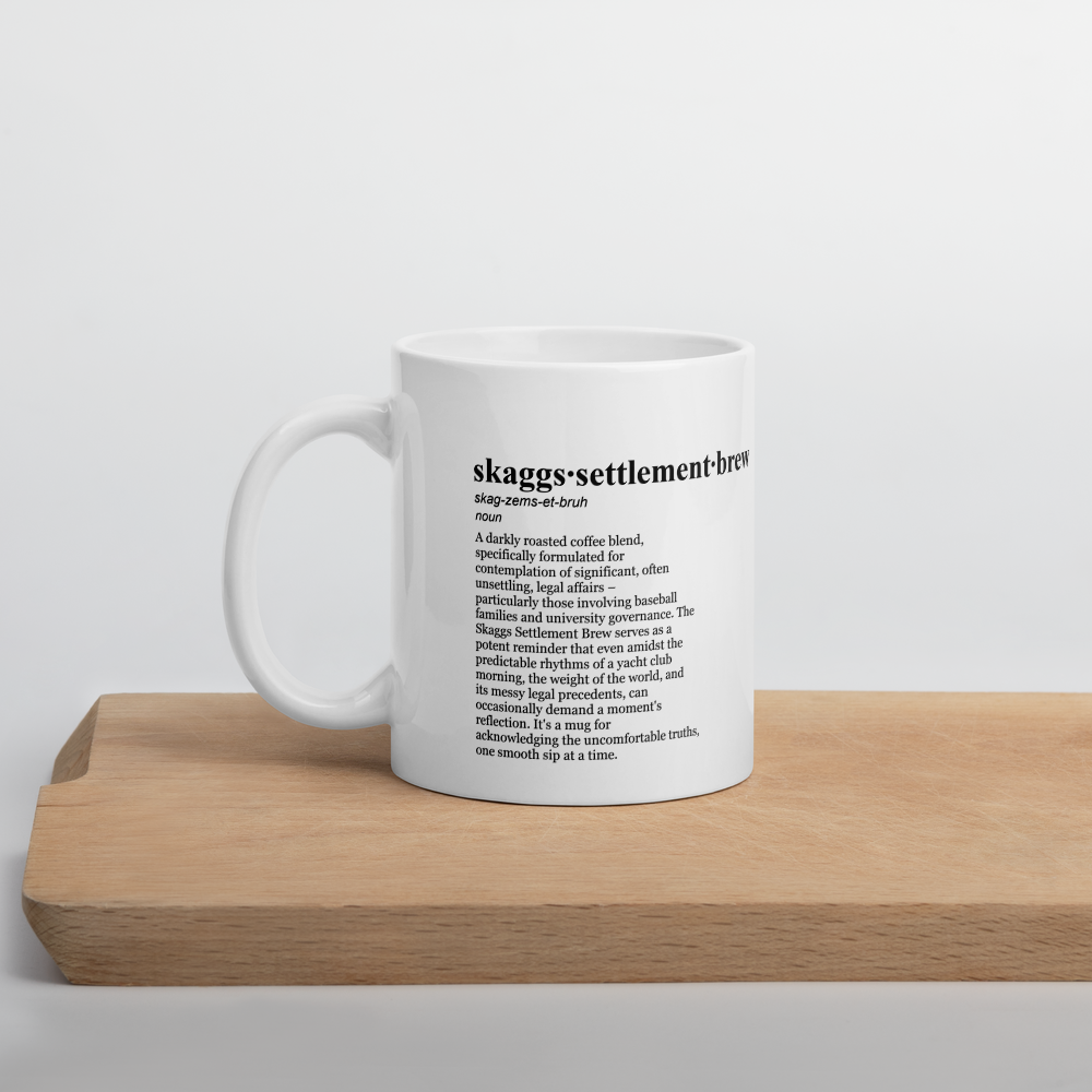 White ceramic coffee mugs, a Skaggs family lawsuit mug.