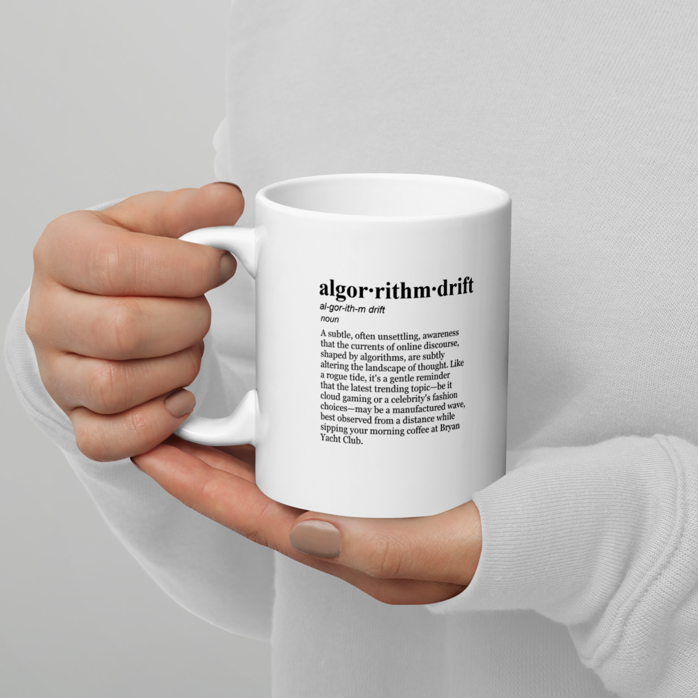 A sleek black ceramic coffee mug, a Bryan Yacht Club mug.